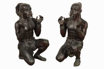Pair Of Crouching Figures