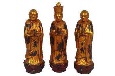 THREE ORIENTAL POLYCHROME AND GILT FIGURES