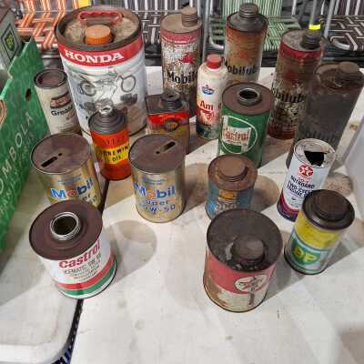 Quantity of assorted vintage oil tins including Mobilube and Caltex